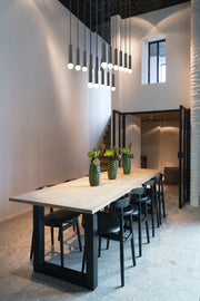 Stari 17 Light 42" Linear Pendant in Matte Black in a room setting