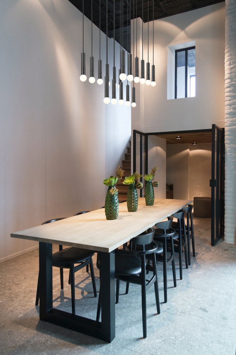 Stari 17 Light 42" Linear Pendant in Matte Black in a room setting