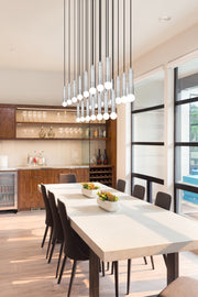Stari 23 Light 54" Linear Pendant in Brushed Nickel in a room setting