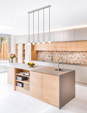 Stari 5 Light 42" Linear Pendant in Brushed Nickel in a room setting