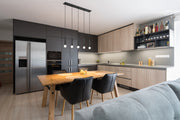 Stari 5 Light 42" Linear Pendant in Matte Black in a room setting