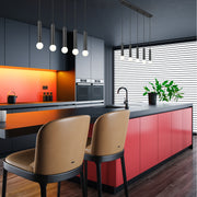 Stari 5 Light 42" Linear Pendant in Matte Black in a room setting