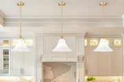 Fleur 1 Light 12" Pendant in Modern Gold in a room setting