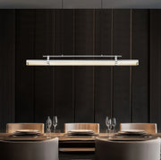 Benoit 1 Light 56" Linear Pendant in Brushed Nickel in a room setting