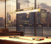 Benoit 1 Light 56" Linear Pendant in Modern Gold in a room setting