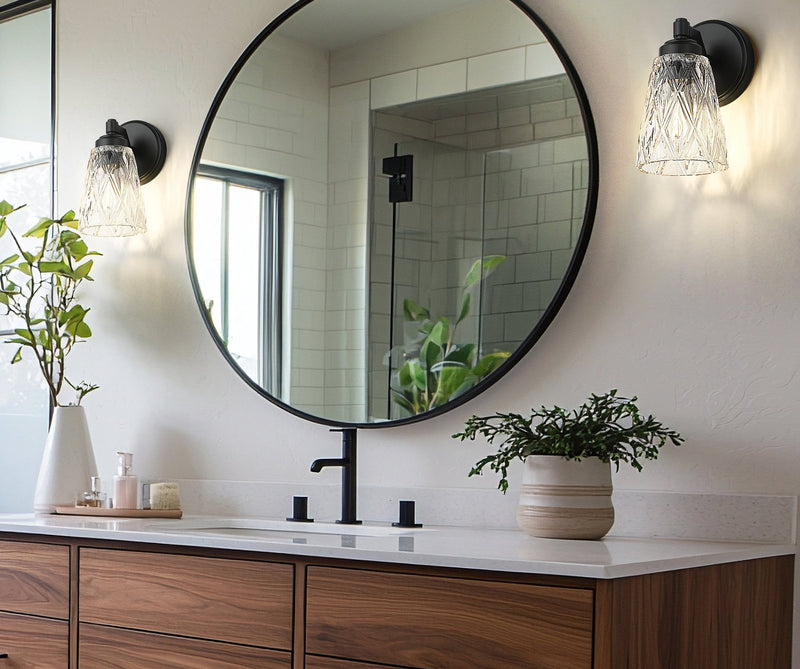 Andree 1 Light 5" Wall Sconce in Matte Black in a room setting