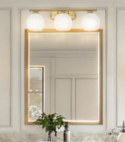 Colette 3 Light 24" Vanity in Modern Gold in a room setting