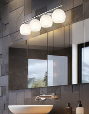 Colette 4 Light 32" Vanity in Brushed Nickel in a room setting