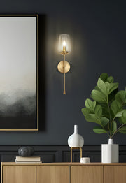 Dominique 1 Light 5.75" Wall Sconce in Modern Gold in a room setting