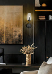 Clara 1 Light 5.5" Wall Sconce in Matte Black in a room setting