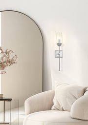 Cosmo 1 Light 5" Wall Sconce in Brushed Nickel in a room setting
