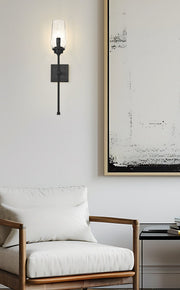 Cosmo 1 Light 5" Wall Sconce in Matte Black in a room setting