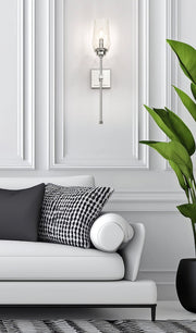 Cosmo 1 Light 5" Wall Sconce in Polished Nickel in a room setting