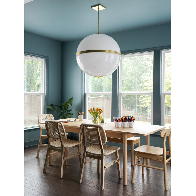 Truax 4 Light 30" Pendant in Aged Brass in a room setting