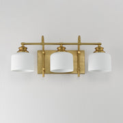 Bisque 3 Light Bath Vanity Light in Natural Aged Brass