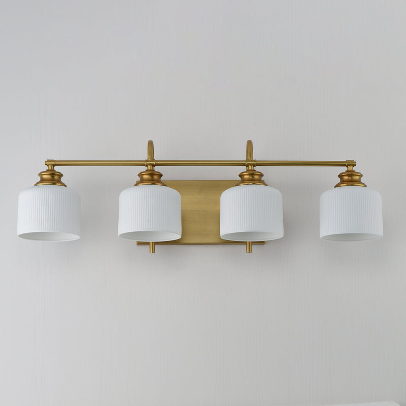Bisque 4 Light Bath Vanity Light in Natural Aged Brass