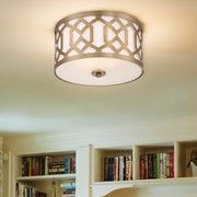 Jennings 3 Light 16.25" Flush Mount in Aged Brass in a room setting