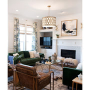 Jennings 5 Light 24.25" Pendant in Aged Brass in a room setting