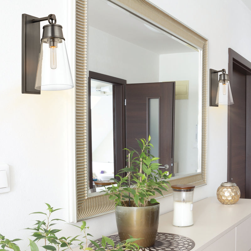 Wentworth 1 Light 7.5" Wall Sconce in Plated Bronze in a room setting