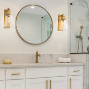 Wentworth 1 Light 7.5" Wall Sconce in Rubbed Brass in a room setting