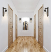 Wentworth 1 Light 4.5" Wall Sconce in Plated Bronze in a room setting