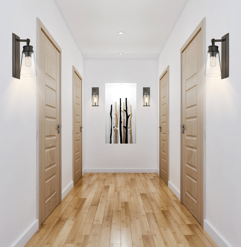Wentworth 1 Light 4.5" Wall Sconce in Plated Bronze in a room setting