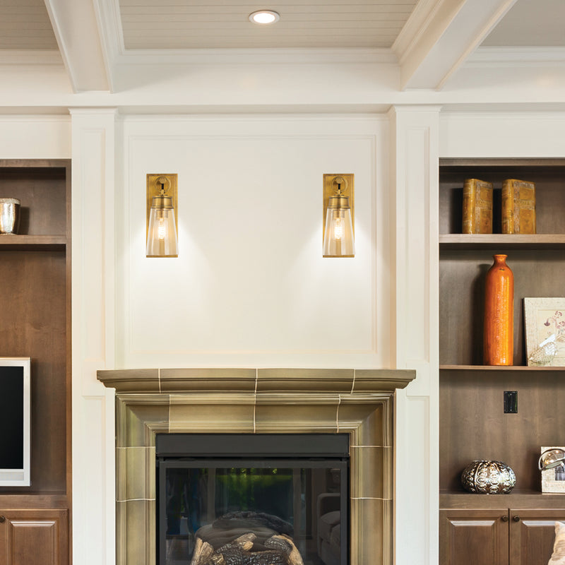 Wentworth 1 Light 4.5" Wall Sconce in Rubbed Brass in a room setting