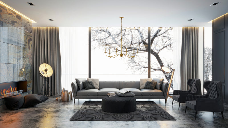 Arrington 6 Light 42" Chandelier in Rubbed Brass in a room setting