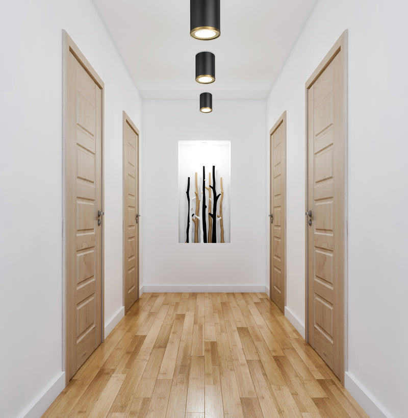Arlo 1 Light 5.25" Flush Mount in Matte Black + Rubbed Brass in a room setting