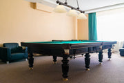 Cordon 3 Light 57.25" Billiard, Glass Shades (A) in Bronze in a room setting