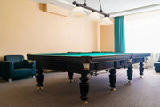 Cordon 3 Light 57.25" Billiard, Glass Shades (A) in Bronze in a room setting