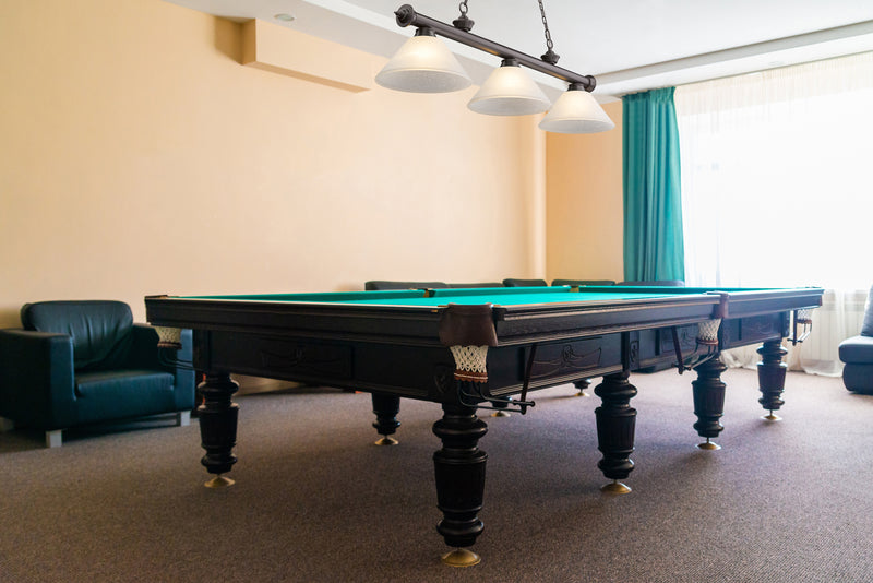 Cordon 3 Light 57.25" Billiard, Glass Shades (A) in Bronze in a room setting