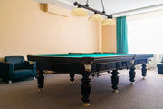 Cordon 3 Light 57.25" Billiard, Glass Shades (D) in Bronze in a room setting