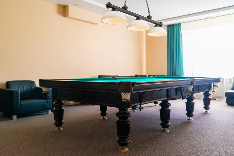 Cordon 3 Light 57.25" Billiard, Glass Shades (D) in Bronze in a room setting