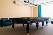 Cordon 3 Light 57.25" Billiard, Glass Shades (D) in Bronze in a room setting