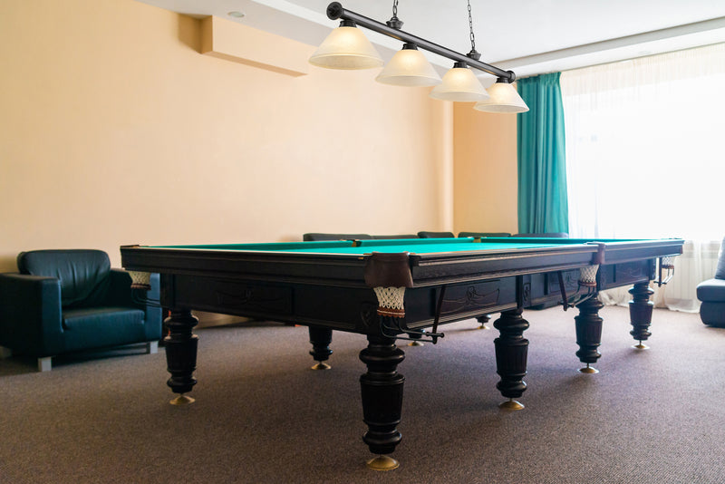 Cordon 4 Light 81.25" Billiard, Glass Shades (A) in Bronze Plate in a room setting