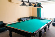 Cordon 4 Light 81.25" Billiard, Bronze Plate with Bronze Plate Shades in Bronze Plate in a room setting