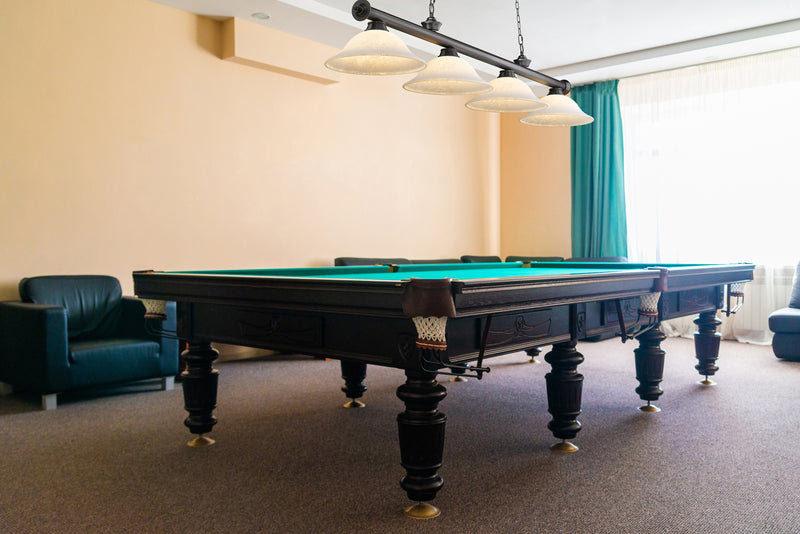 Cordon 4 Light 81.75" Billiard, Glass Shades in Bronze Plate in a room setting