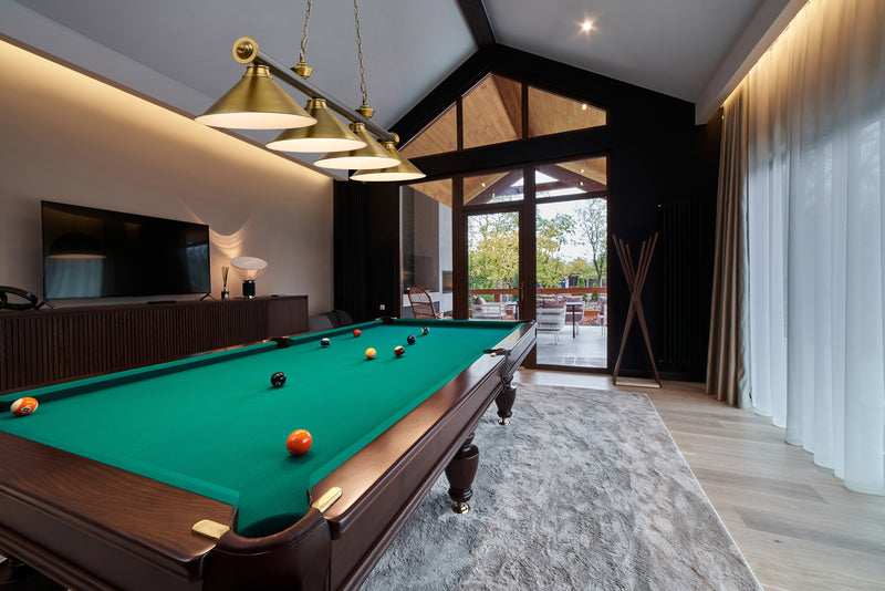 Cordon 4 Light 81.25" Billiard, Matte Black + Rubbed Brass with Rubbed Brass Shades (4MB-RB-RB15) in Matte Black + Rubbed Brass in a room setting