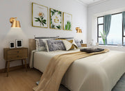Lilly 1 Light 8" Wall Sconce in Modern Gold in a room setting
