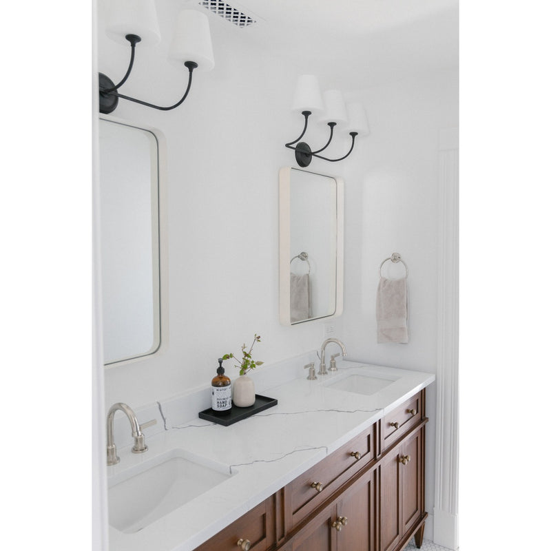 Sylvan 3 Light 23.25" Bathroom Vanity in Black Forged in a room setting