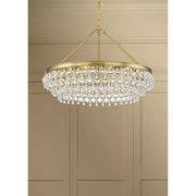Calypso 6 Light 30" Chandelier in Vibrant Gold in a room setting