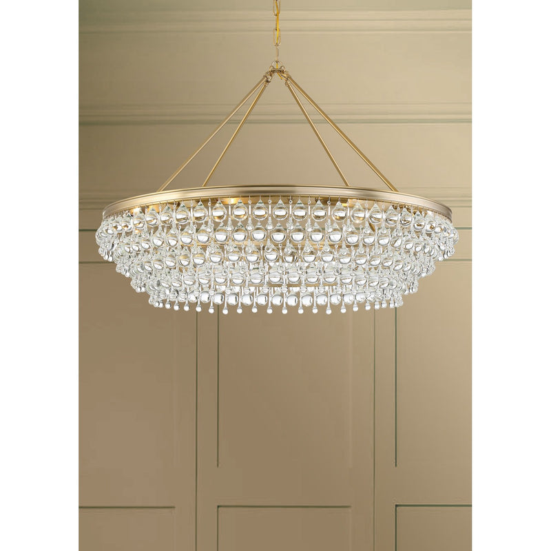 Calypso 8 Light 40" Chandelier in Vibrant Gold in a room setting
