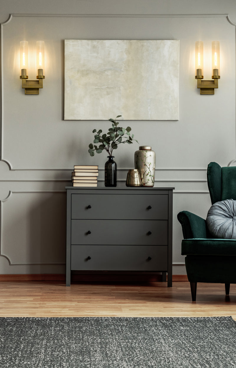 Beau 2 Light 8.25" Wall Sconce in Rubbed Brass in a room setting