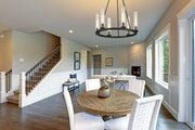 Beau 6 Light 26" Chandelier in Bronze in a room setting