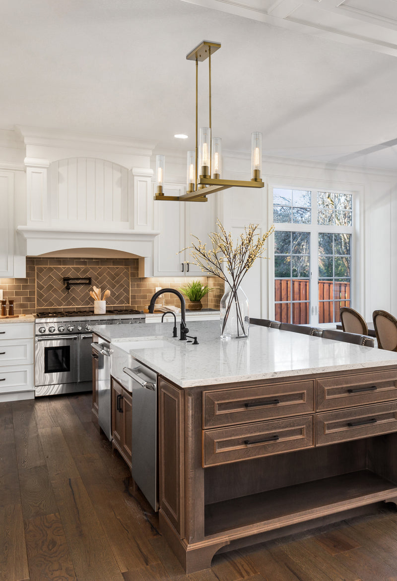 Beau 7 Light 44" Linear Pendant in Rubbed Brass in a room setting