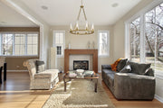 Beau 8 Light 33" Chandelier in Rubbed Brass in a room setting