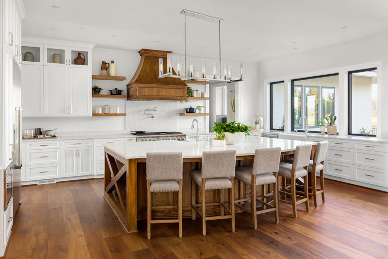 Beau 9 Light 56" Linear Pendant in Polished Nickel in a room setting