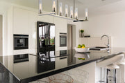 Beau 9 Light 56" Linear Pendant in Polished Nickel in a room setting