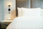 Callista 1 Light 6.5" Wall Sconce, 26" Tall in Matte Black in a room setting